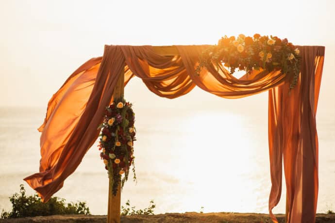 square wooden wedding arch on outdoor sunset wedding ceremony. r